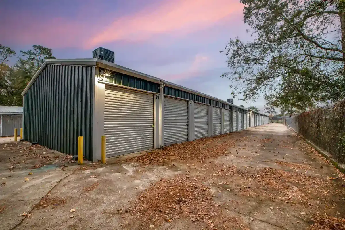fenced storage facility with roll up doors and drive up access