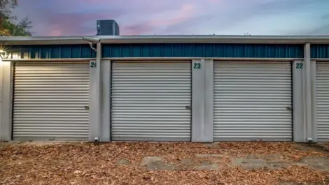 outside a storage facility with roll up doors and drive up access