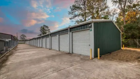 fenced storage facility with roll up doors and drive up access