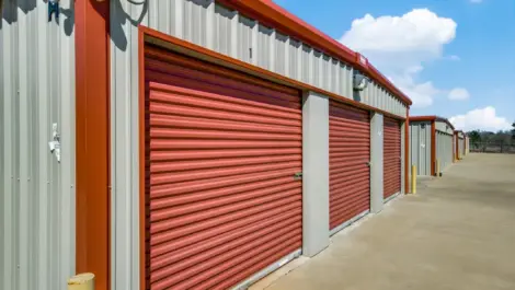 row of storage units with drive up access and camera surveillance