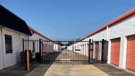 row of self storage units with drive up and secure gated entry